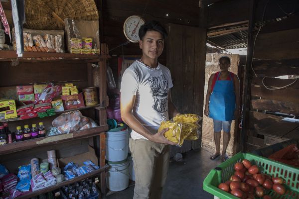 Teenage boy holding packaged food